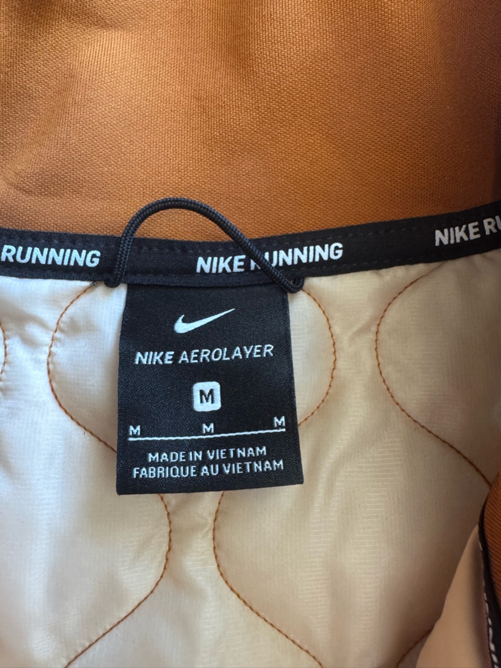 Nike Women’s Quilted Copper-Orange Vest with Black Band - Picture 7 of 9